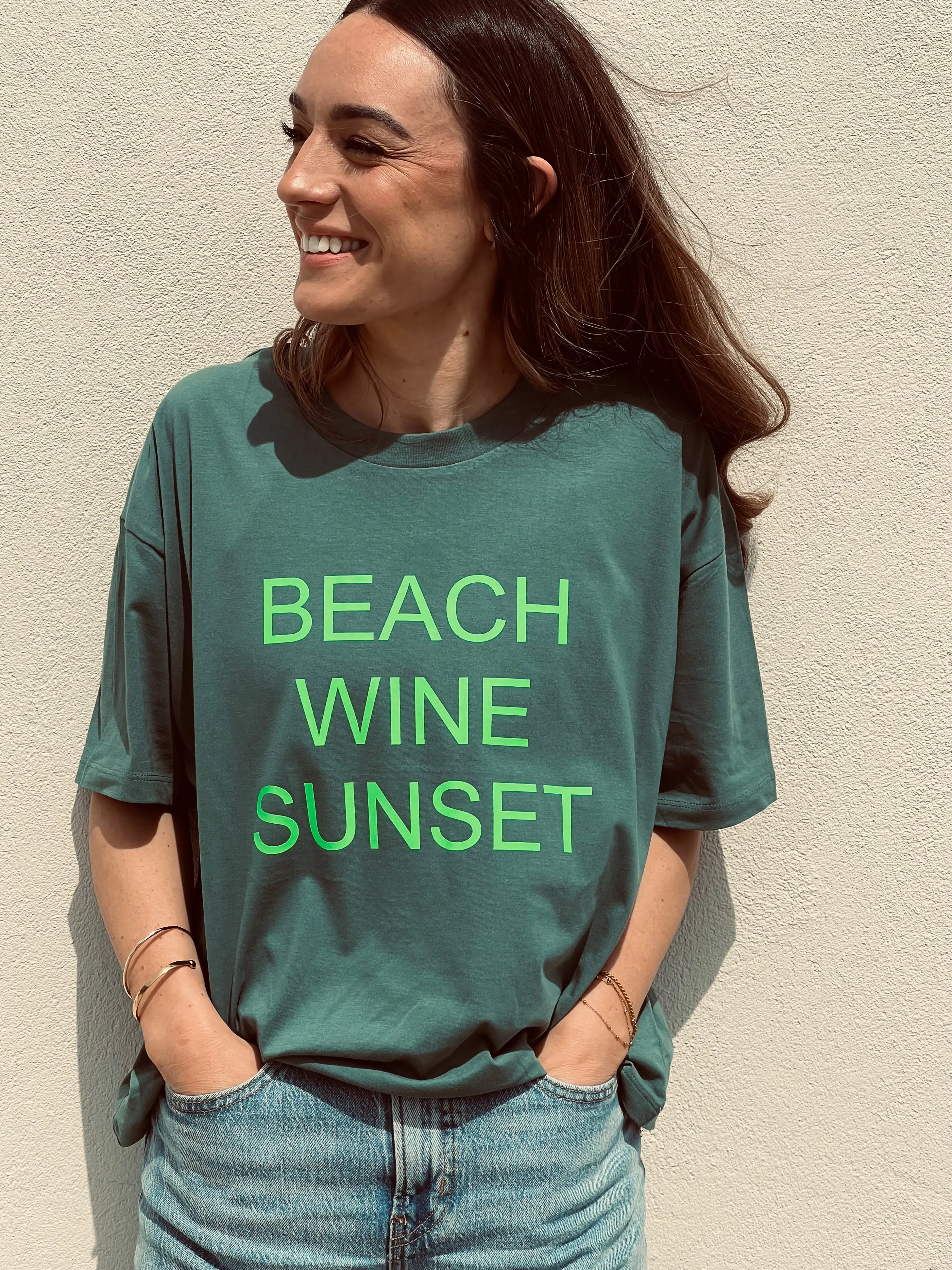 Beach Wine Sunset Boxy Fit Organic Cotton Tee - Sage Green  with a Neon Lime font.